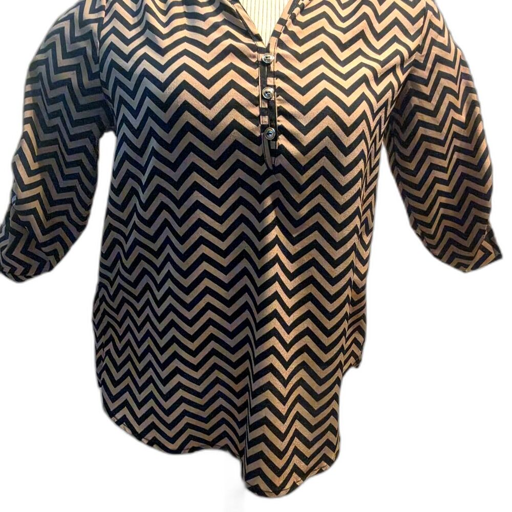 tan and black geometric/chevron patterned blouse